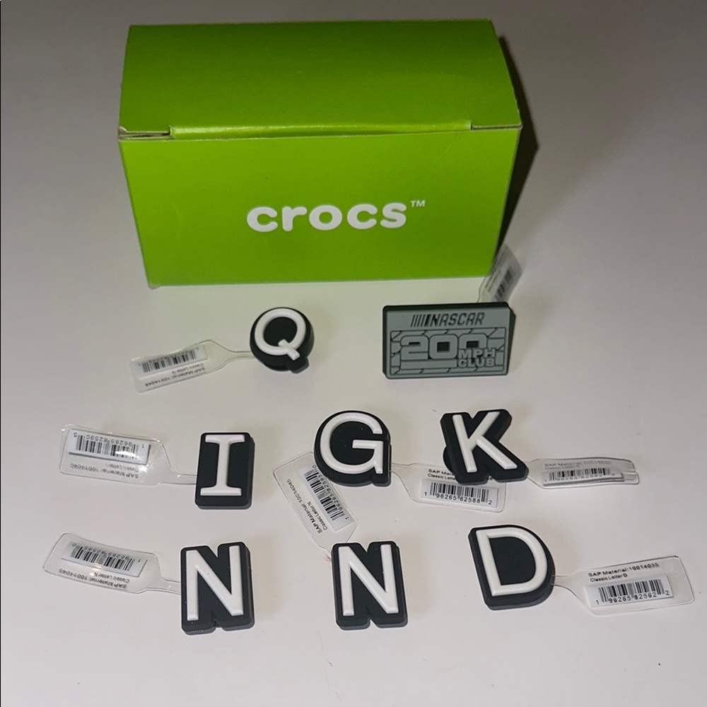 Crocs’s lot of 8 gibbets including a‎ nascar gibbet